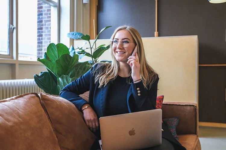 woman on business call with laptop